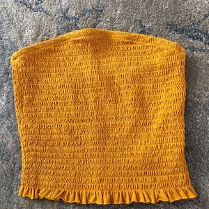 Garage yellow ripped tube top.